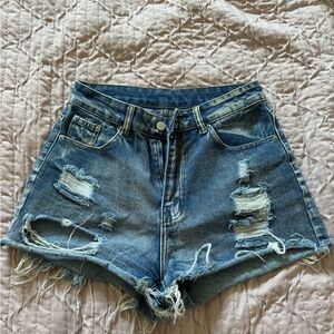 SHEIN distressed denim shorts.